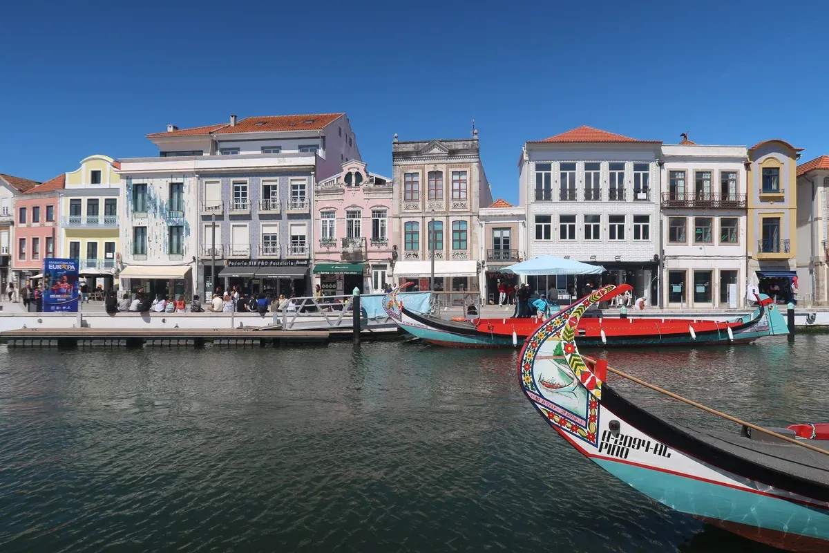 Moliceiro boats on the central canal in Aveiro on a Coimbra and Aveiro day trip from Porto