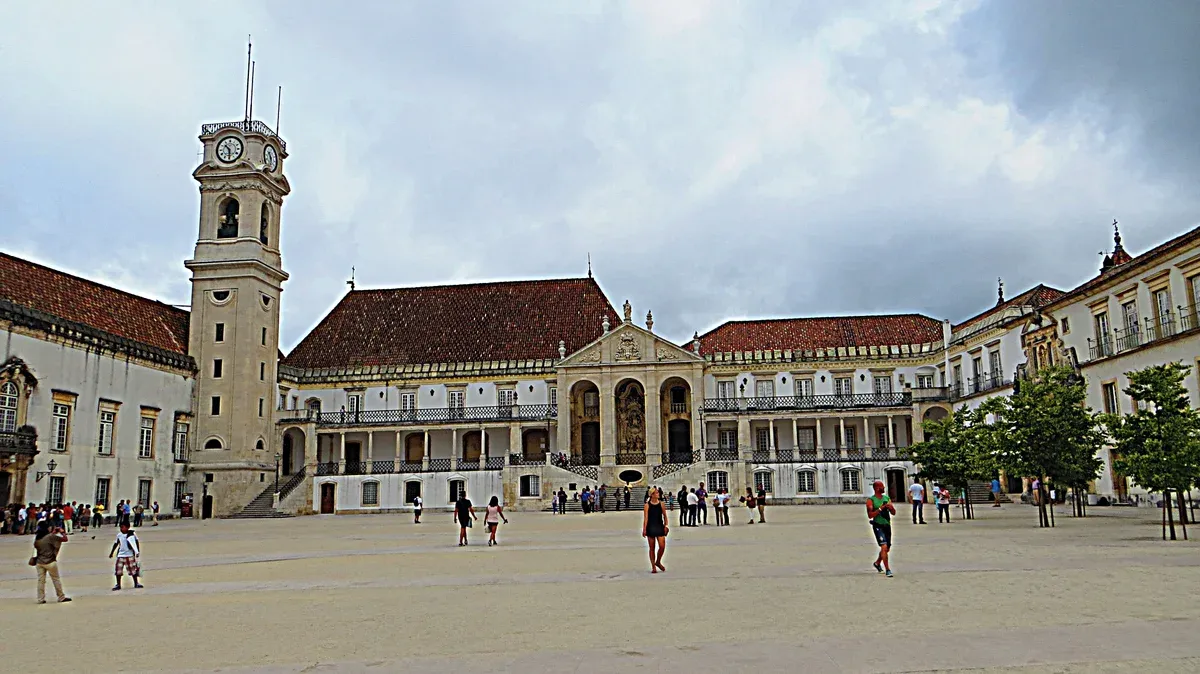 Clock tower and courtyard of the University of Coimbra on a Coimbra and Aveiro day trip from Porto