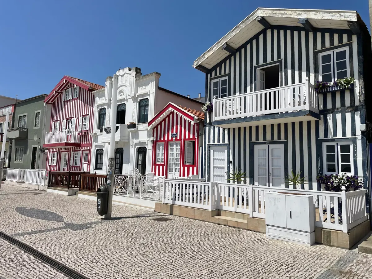 Striped palheiro houses in Costa Nova near Aveiro on a day trip from Porto