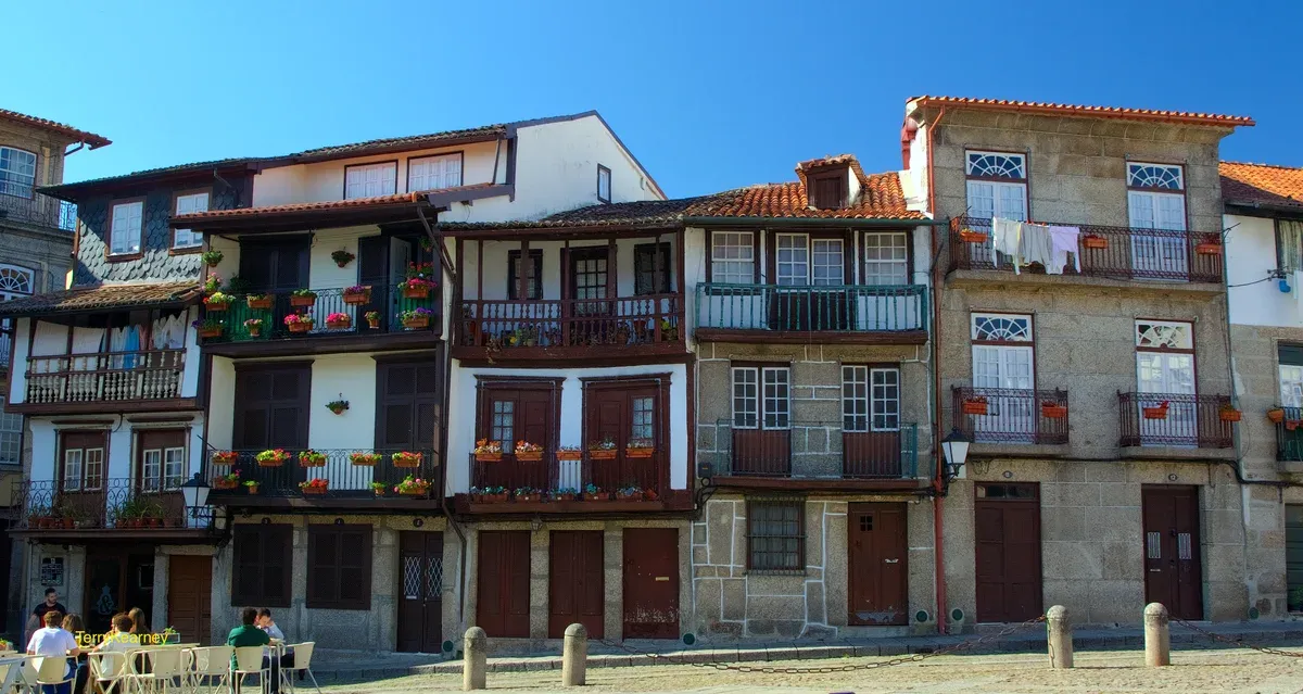 Old town houses with balconies in Guimarães on a Braga and Guimarães day trip from Porto