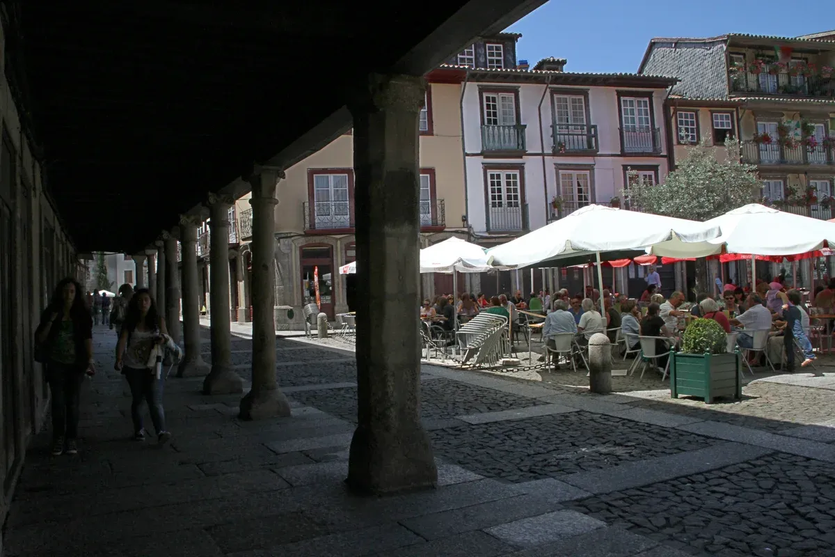 Arcades on Largo da Oliveira in the Guimarães old town on a day trip from Porto